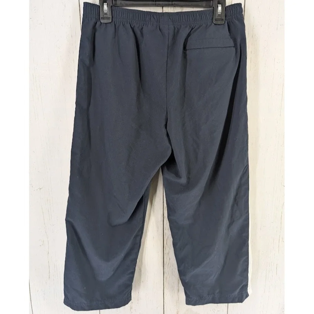 Under Armour Size Medium Dark Blue White Stripe Active Windbreaker Crop‎ Pants - Picture 7 of 7